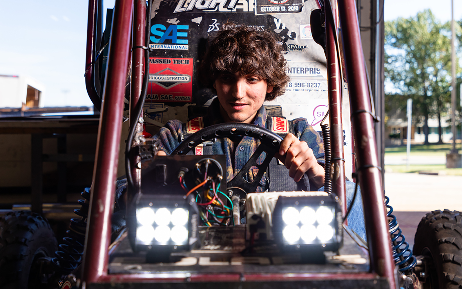 SIU student behind the wheel of a Formula One Car