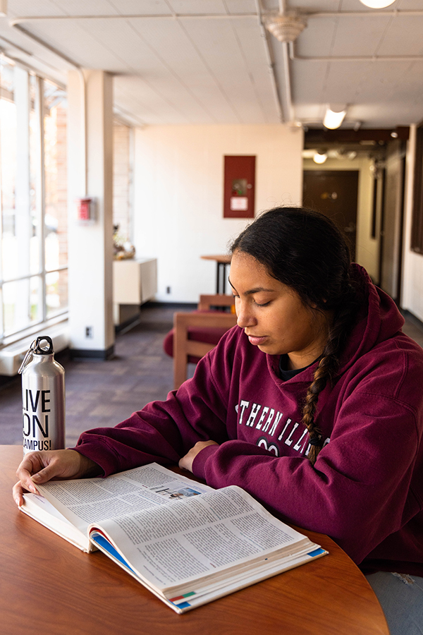 SIU Student studying in a residence hall